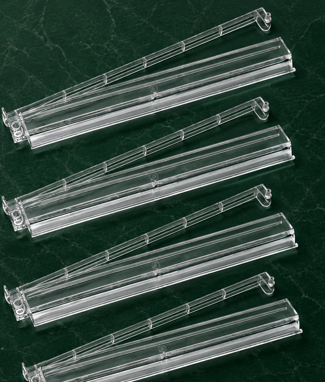 Clear Mahjong tile racks with pushers arranged in a row, designed for smooth gameplay and easy tile management.