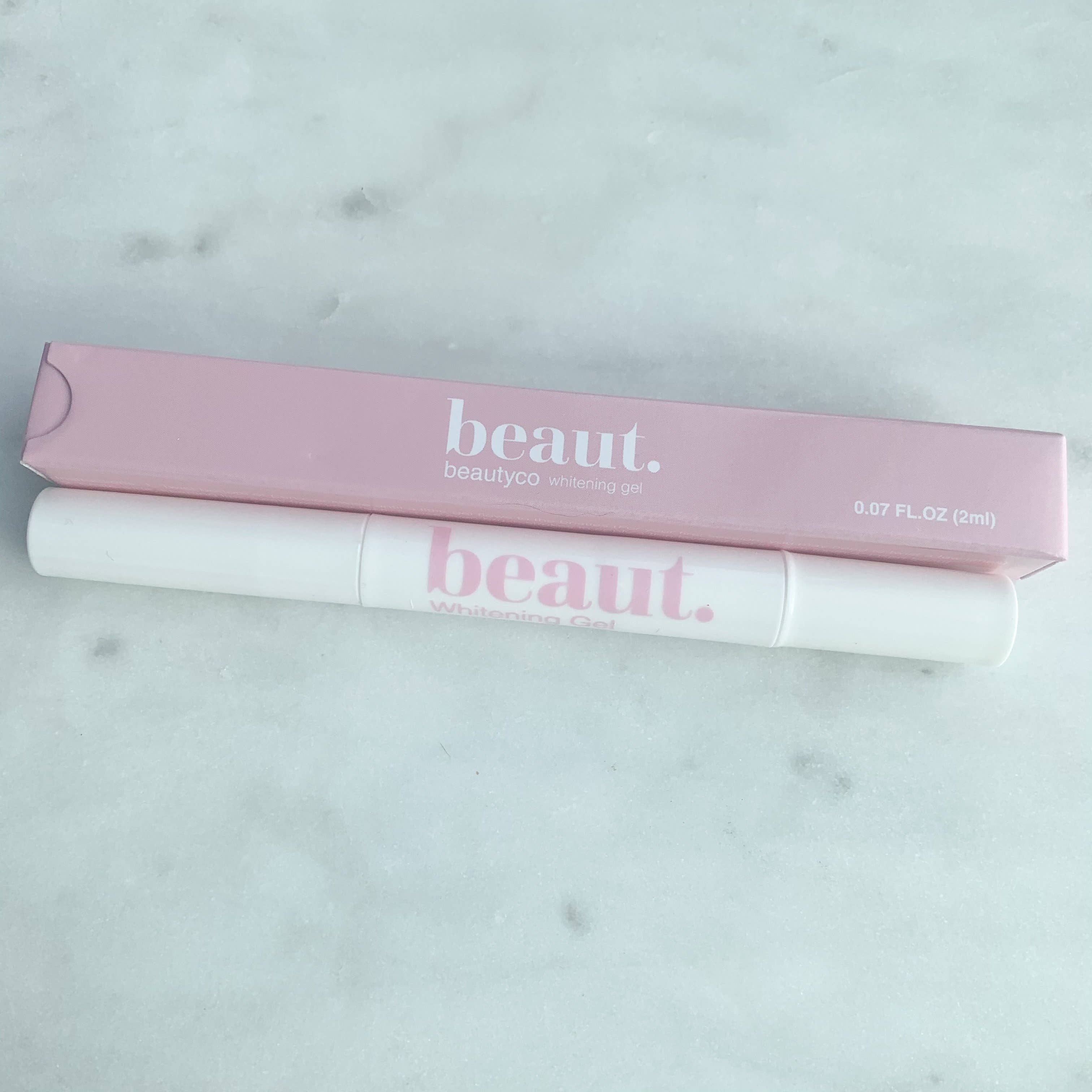 Whitening gel pen in a white body with a pink box, labeled 'beaut.' for effective teeth whitening treatments.