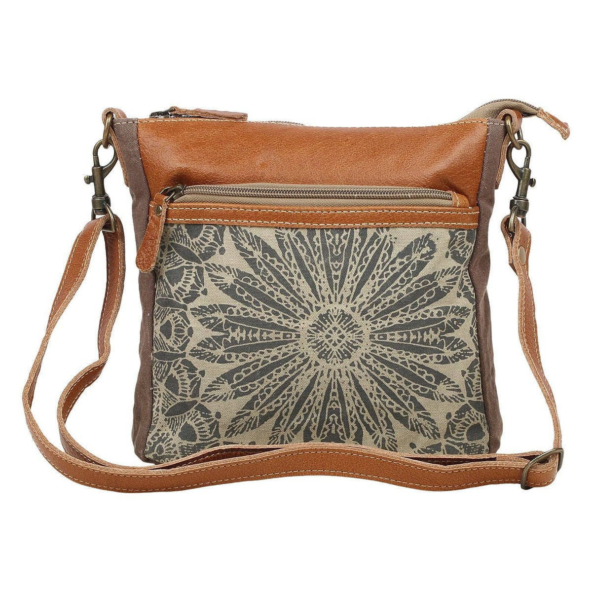 Small crossbody bag in brown canvas and leather with a decorative front pocket, perfect for carrying essentials.