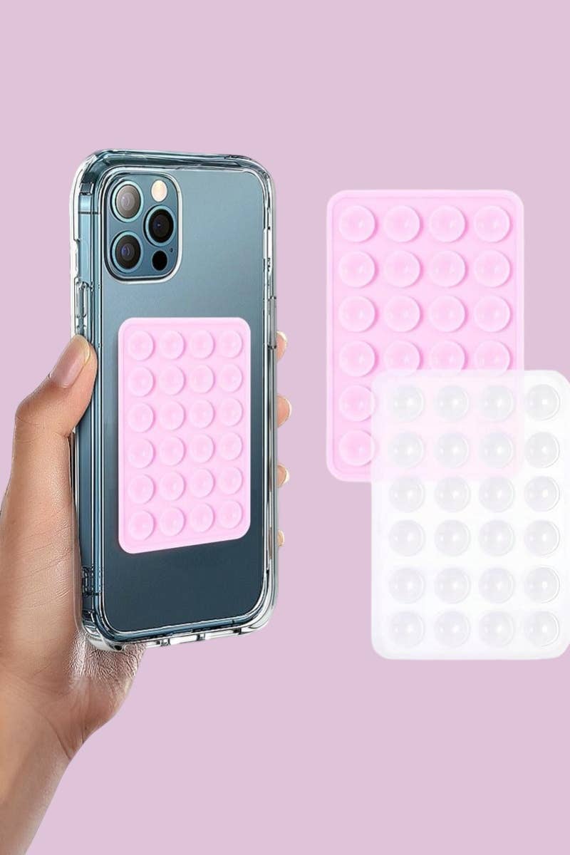 Silicone suction cup phone holder in pink with a grid of circular suction cups, designed for hands-free use.