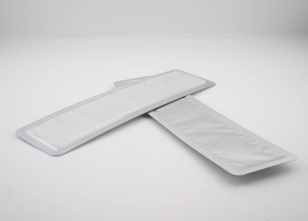 Two textured silicone strips in a clear package, part of Scarfade Scar Sheets designed to help fade scars.