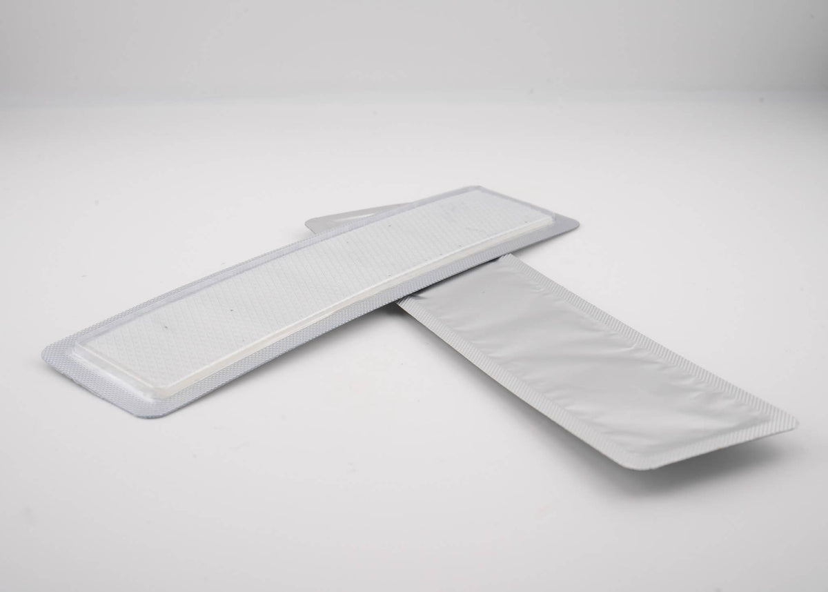 Two textured silicone strips in a clear package, part of Scarfade Scar Sheets designed to help fade scars.
