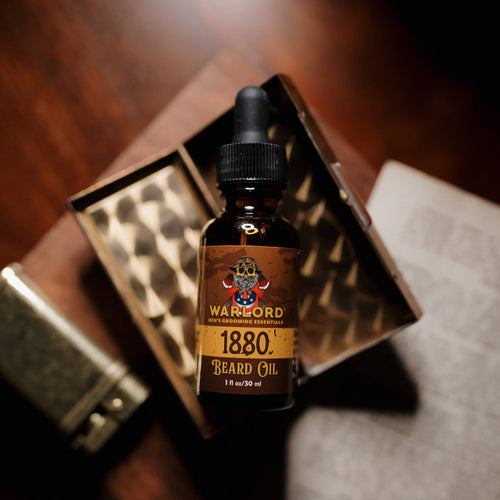 Dark glass bottle of 1880 Beard Oil with a dropper cap, showcasing a refined grooming essential for men.