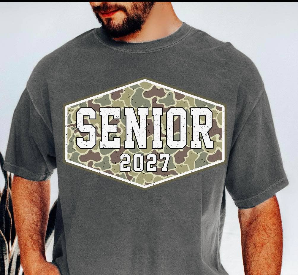 Camo t-shirt featuring 'SENIOR 2027' in bold text, designed for comfort and style in a relaxed fit.