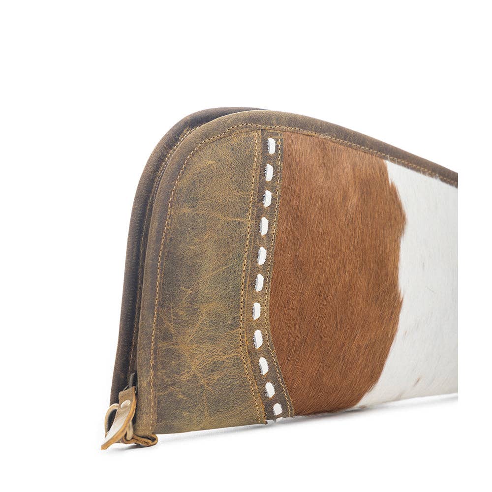 Dusty Trail 15″ Gun Case featuring a unique hairon design and chocolate brown leather trim with a wrap-around zipper.