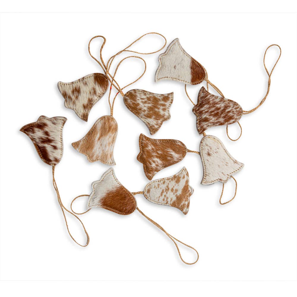 A collection of ten unique brown and white hair-on hide bell ornaments with natural jute hangers.