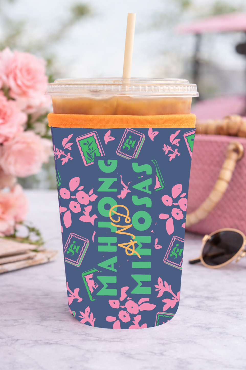 Colorful iced coffee sleeve featuring 'MAHJONG AND MIMOSAS' text, perfect for stylishly keeping drinks cool.