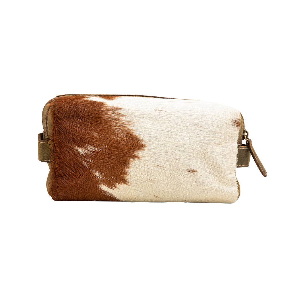 A stylish Ferald Shaving Kit featuring a hair-on hide texture and leather, perfect for grooming essentials.