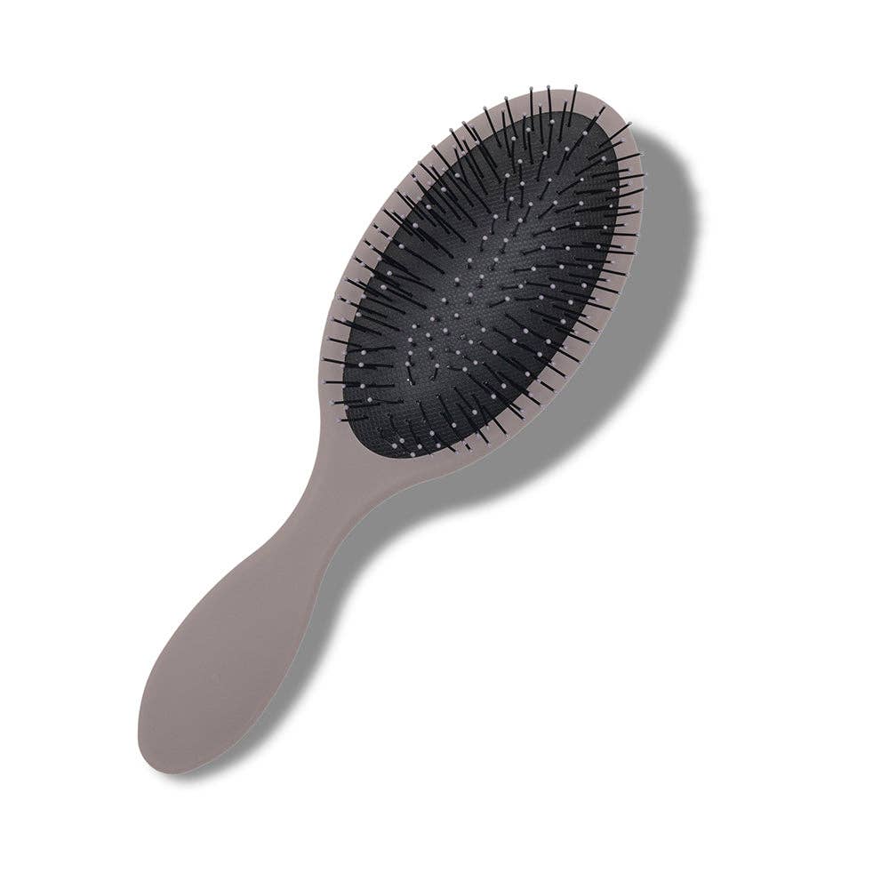 Oval-shaped hairbrush with a cloud gray handle and full bristles, featuring a black bristle area and unique back designs.