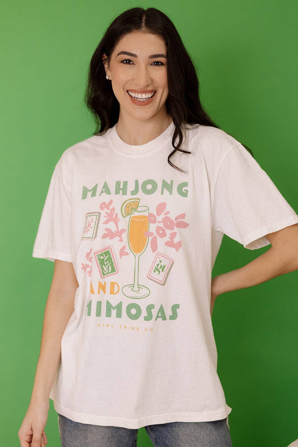 White Mahjong and Mimosas Tee featuring a graphic design with cocktail glass and floral elements, perfect for casual wear.