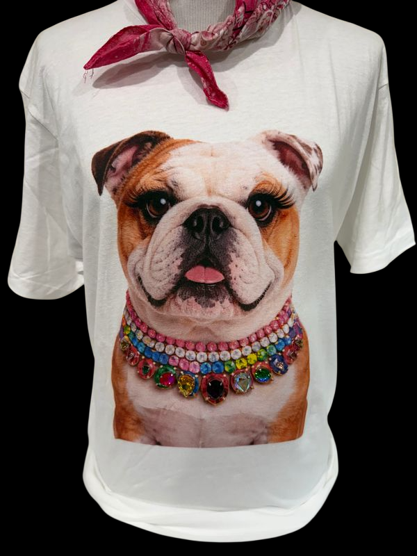 A friendly bulldog wearing a colorful jeweled collar on a white t-shirt, showcasing sparkling embellishments.