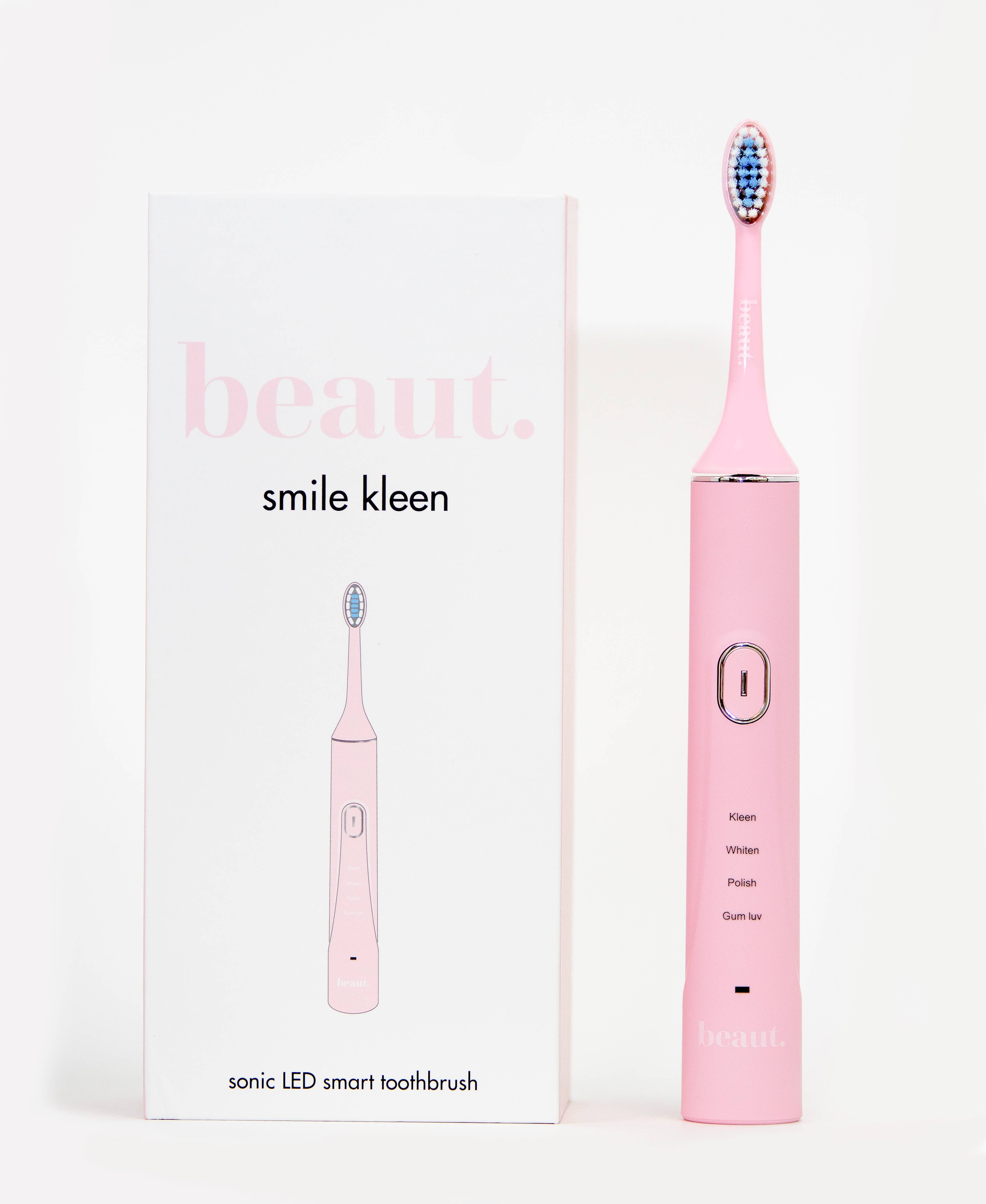 Pink Smile Kleen Sonic Vibration Toothbrush with blue and red bristles, featuring a modern design and visible power button.