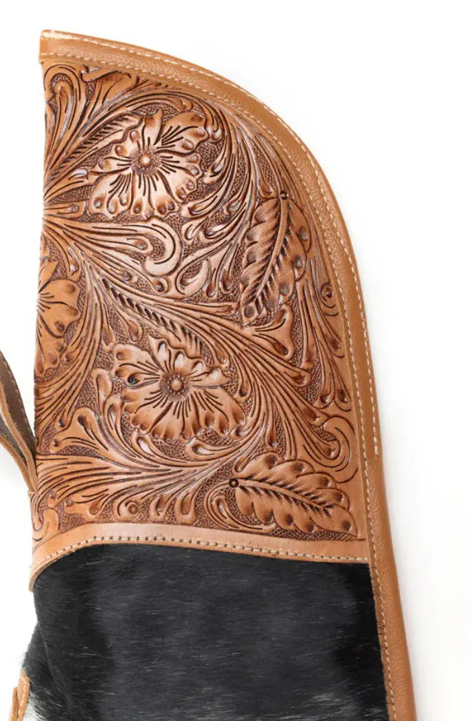 Black and white hair-on hide rifle case featuring hand-tooled leather panel and caramel brown leather trim.