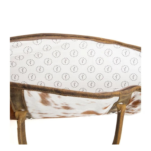 A stylish 47" gun case featuring a mix of brown and white colors with a patterned interior lining and zipper closure.