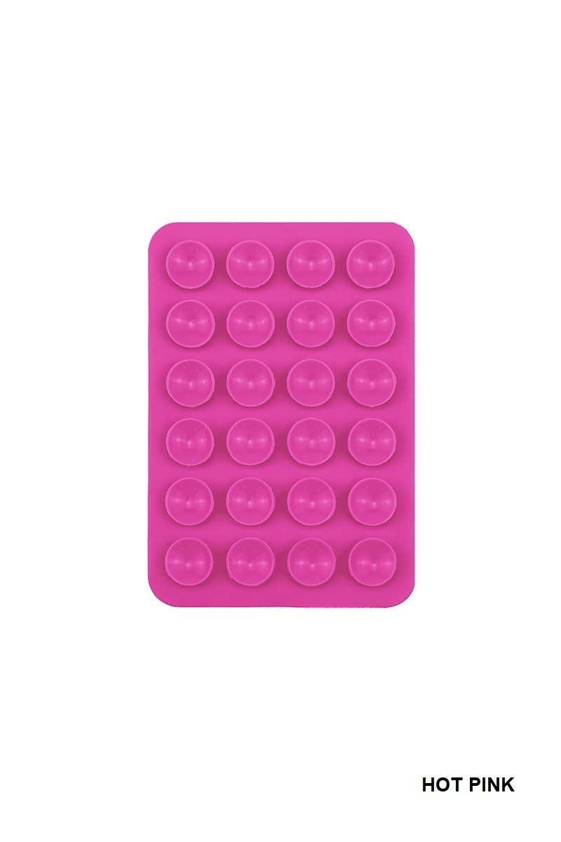 Hot pink silicone suction cup phone holder with multiple suction cups in a grid pattern, perfect for hands-free use.