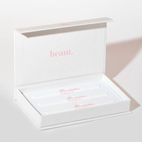 Three smile pens arranged neatly in a white box labeled 'Whitening Gel' from beaut.