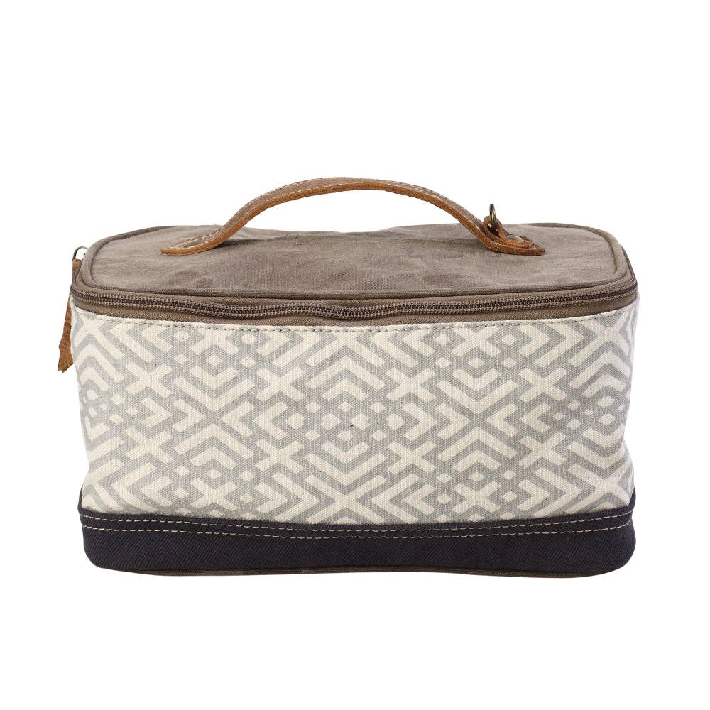 Rectangular canvas and leather shaving kit with a wide mouth opening and secure zippered closure, perfect for travel or storage.