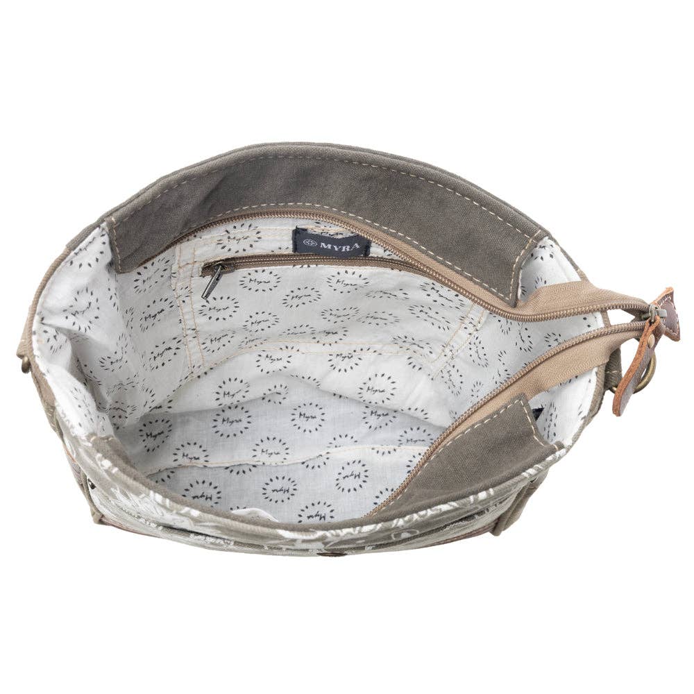 Blossom print shoulder bag featuring a zippered interior compartment and a comfortable shoulder strap.
