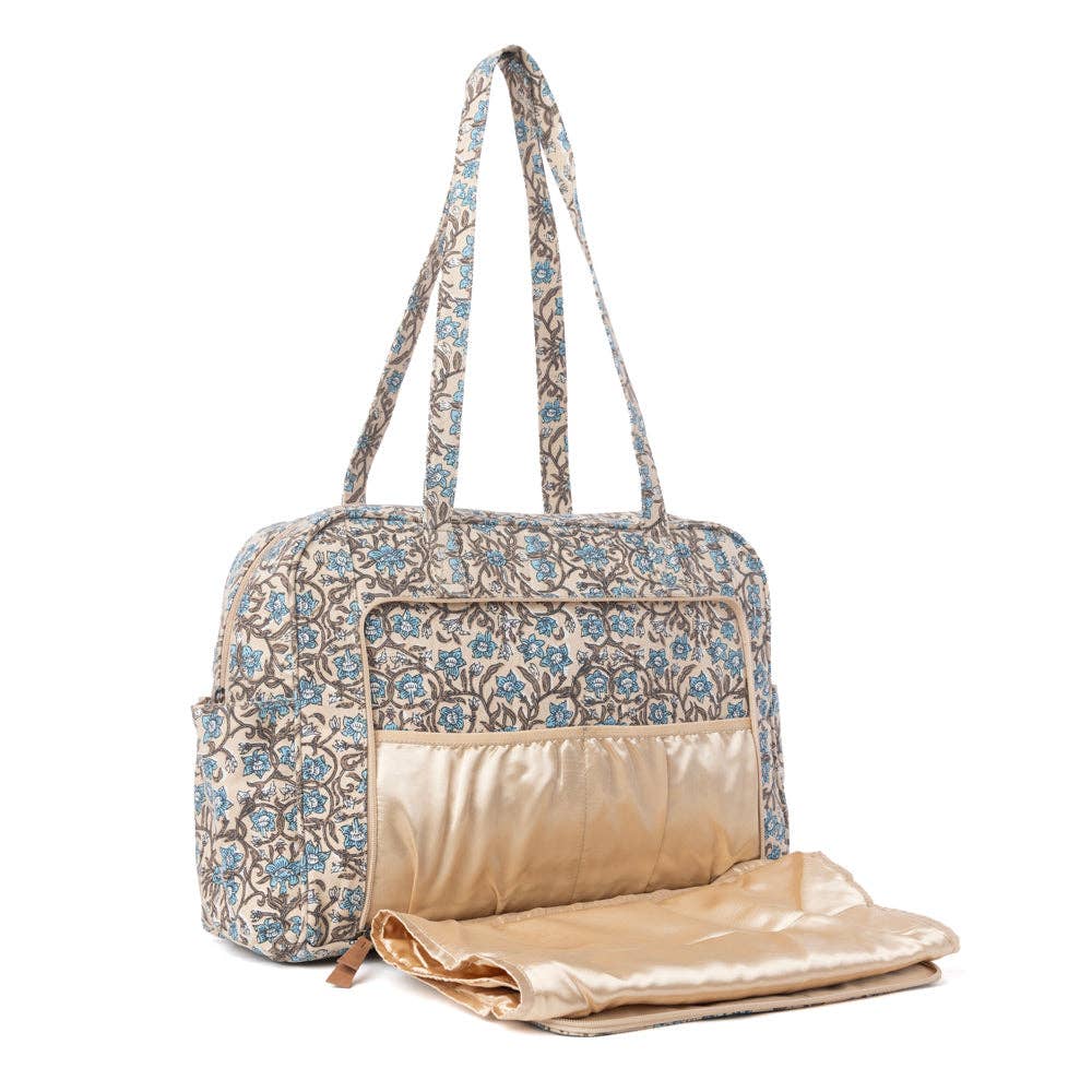Vintage floral diaper bag in dusty teal with a spacious main compartment and structured shape for easy organization.