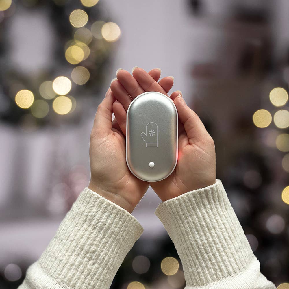 Hand warmer resembling a mitten with a snowflake symbol and button, designed for warmth and convenience.