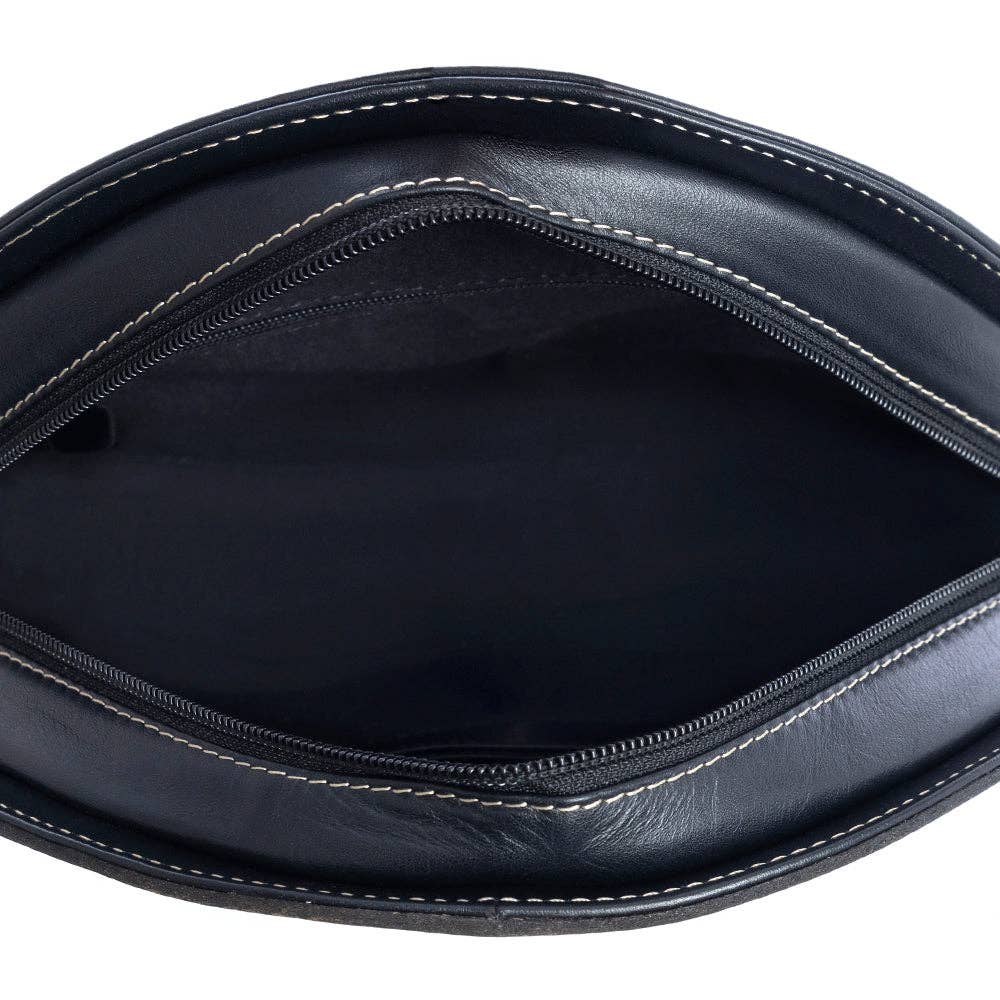 The interior of the Pinetop Canyon Round Bag features a dark lining with visible stitching and a secure zippered closure.