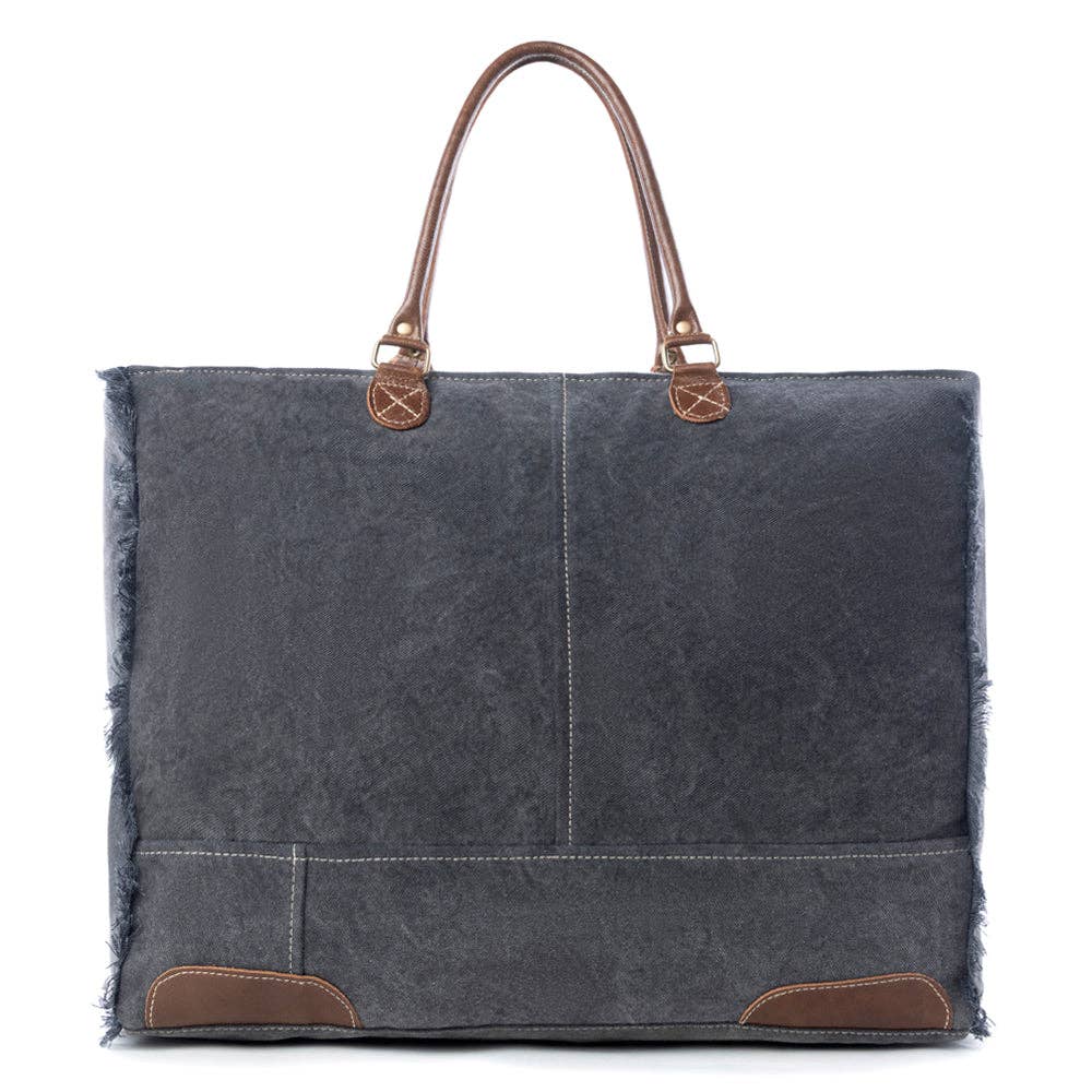 A stylish weekender bag featuring leather top handles, zipper closure, and a roomy interior for all your weekend essentials.