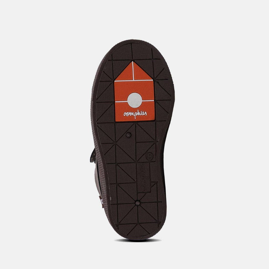 Dark brown boot outsole featuring a patterned tread design, showcasing the durability of the Gabriel Young Boys Hook & Loop Boot.