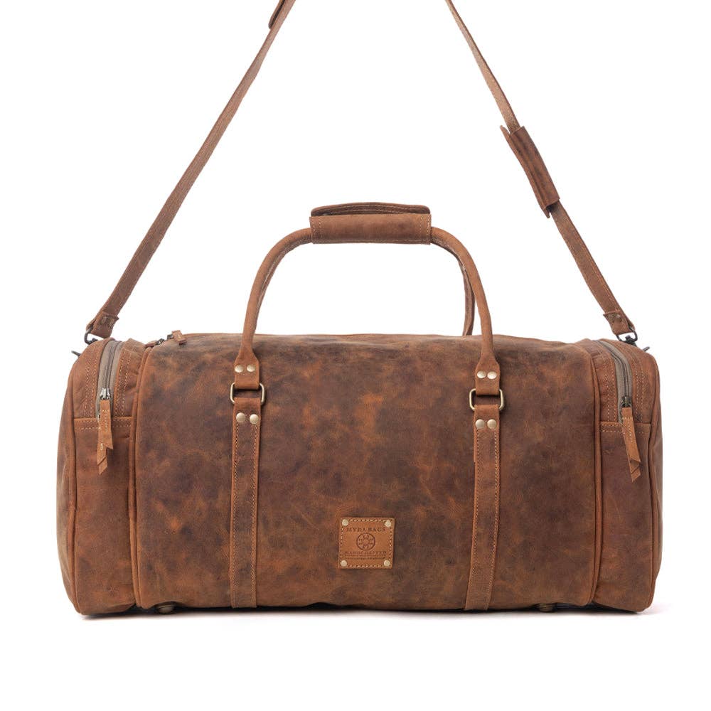 Amber brown leather traveller bag with a structured shape, dual handles, and zipper closure, perfect for weekend getaways.