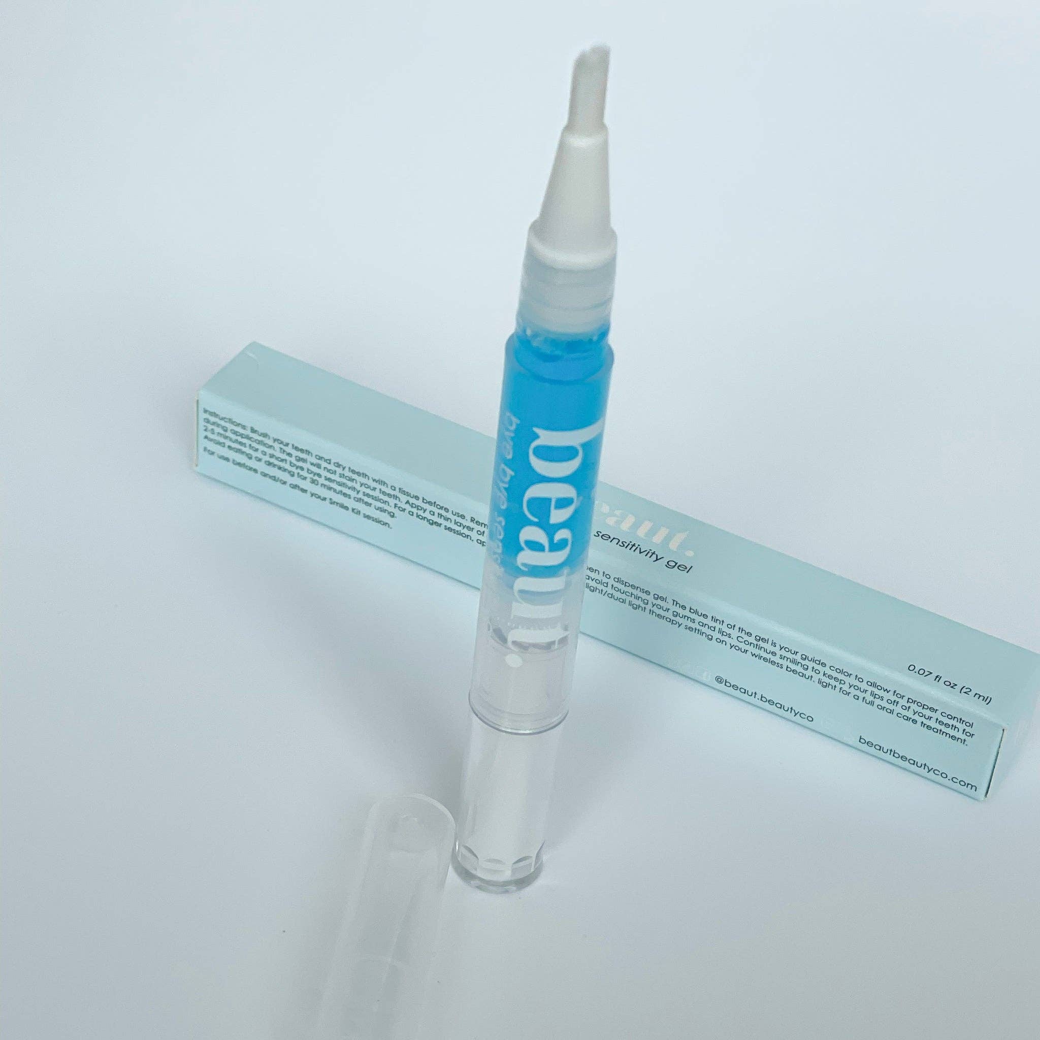 Clear gel pen with a blue cap and pointed applicator tip for easy application of teeth sensitivity treatment.