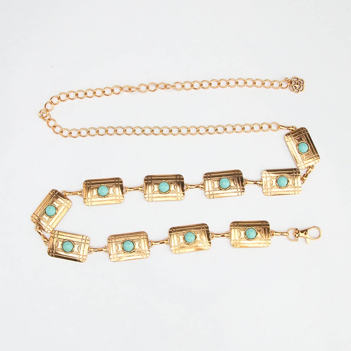 Waist chain belt featuring a vintage pattern with turquoise decor and gold-tone rectangular links. Adjustable length with clasp closure.