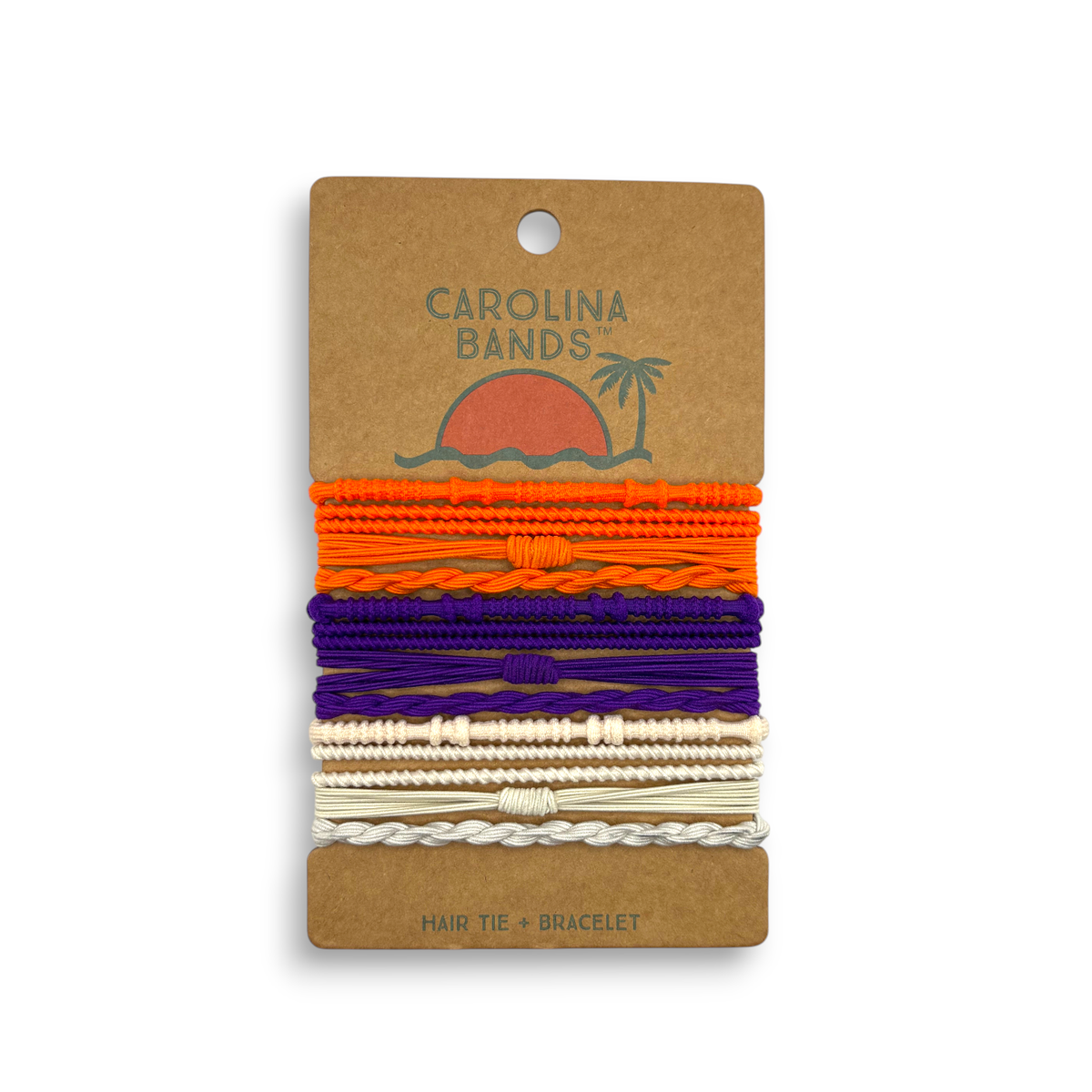 A set of colorful hair tie bracelets in orange, purple, and cream with various textures, displayed on a card featuring a sun and palm tree design.