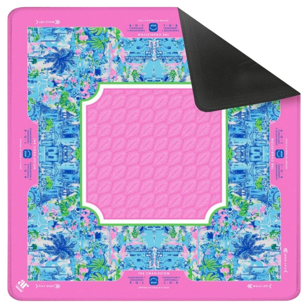 Vibrant pink Mahjong mat featuring a tropical floral design, solid pink center, and black underside for stylish gameplay.