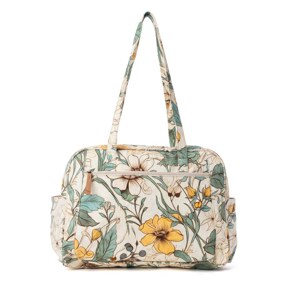 Floral-patterned Sunnyfield Cotton Diaper Bag in ochre fern with spacious main compartment and structured shape for easy carrying.