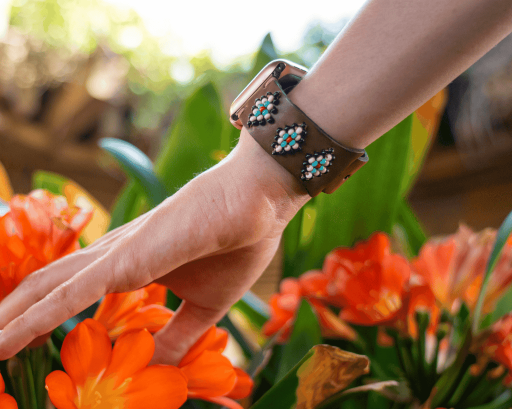 Beaded leather Apple Watch band featuring a Navajo and Aztec inspired design, handcrafted with glass beads.