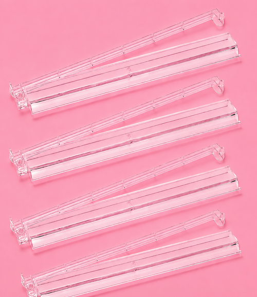Clear Mahjong tile racks arranged in a row, featuring pushers for easy gameplay and organization. Perfect for game nights.