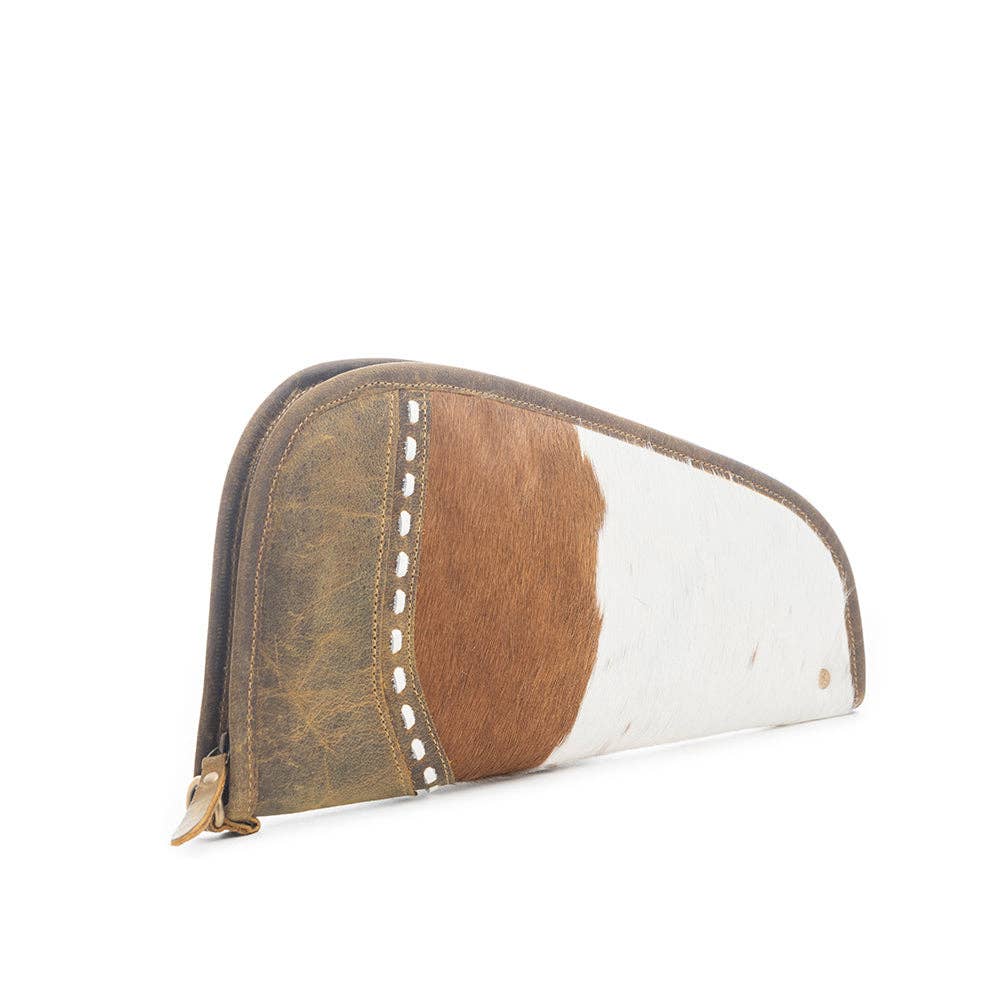 Curved brown leather gun case with a unique white-and-brown hairon section and a wrap-around zipper.