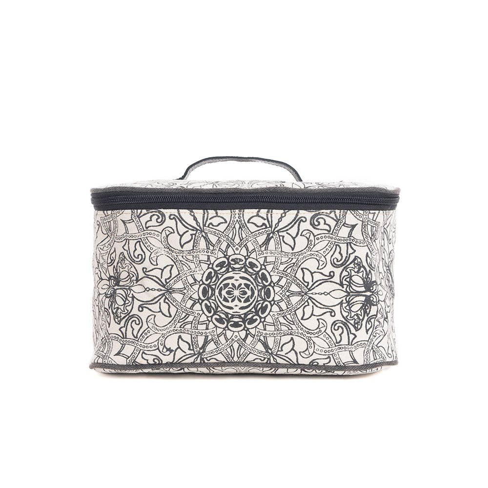 Black and white woven canvas toiletries bag with a wrap-around zipper and ebony leather handle. Perfect for travel or everyday use.