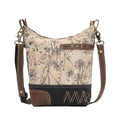 Floral canvas shoulder bag featuring a front pocket and zippered top closure, perfect for everyday style.