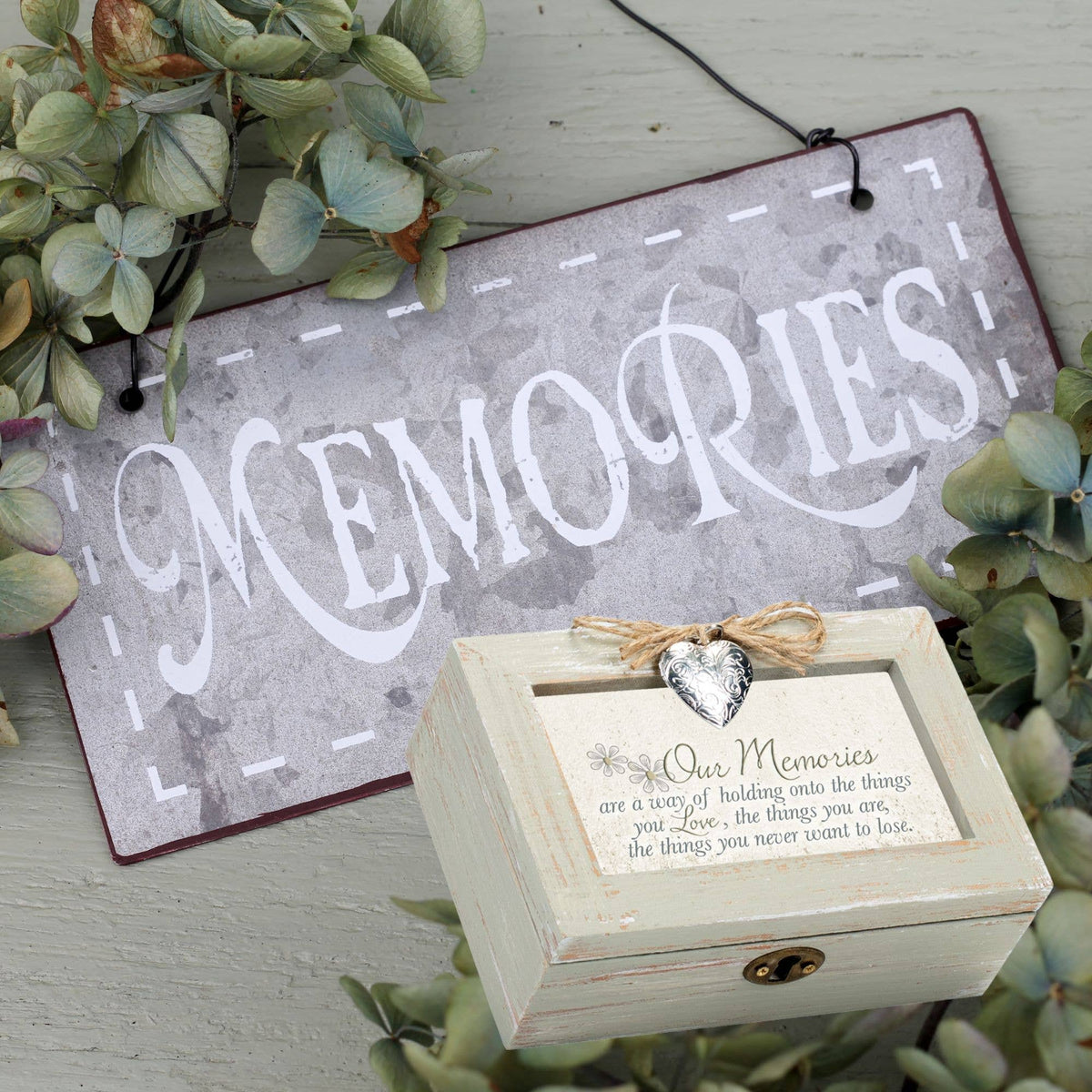 Petite musical keepsake box with rustic plank design, silver heart locket, and jute bow, perfect for storing memories.