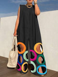 Loose sleeveless jumpsuit featuring a colorblock pattern with circular cutouts and convenient pockets. Perfect for casual outings.
