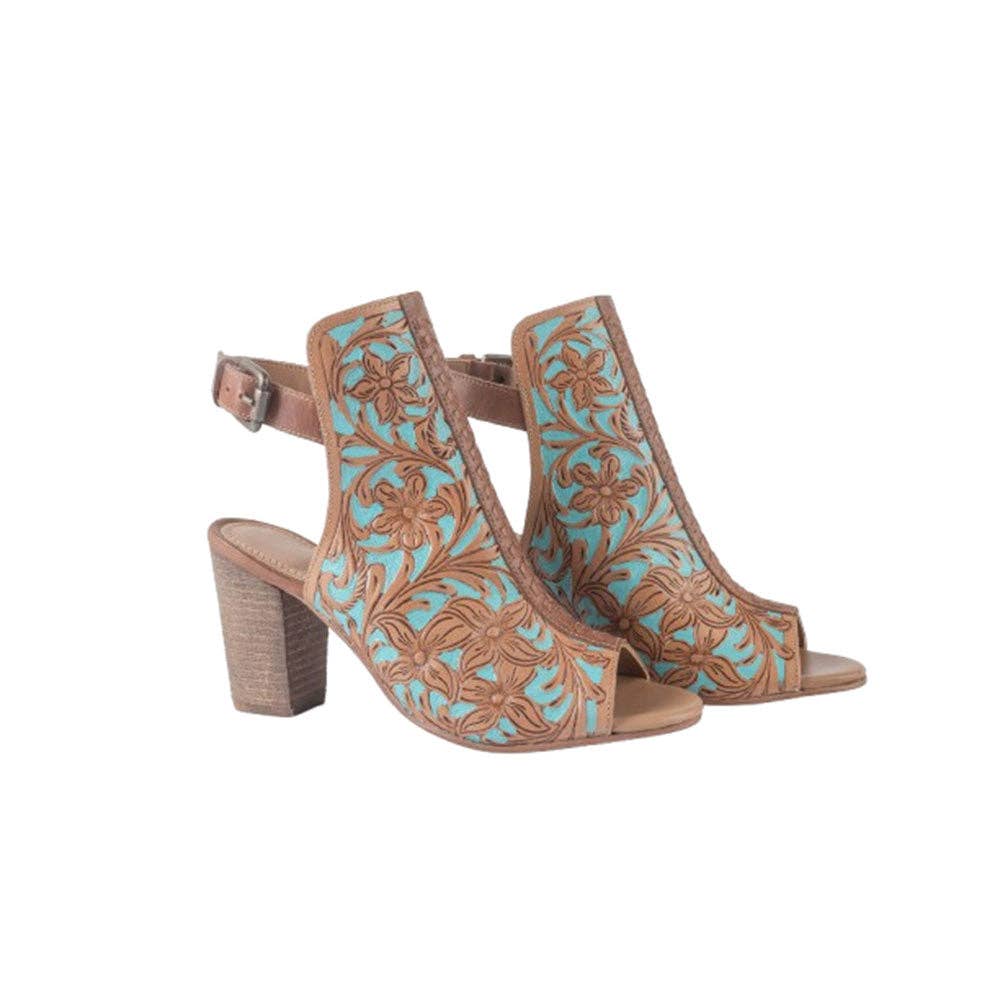 Floral-embossed tan and turquoise heel shoes with an open toe and chunky heel, featuring an ankle strap for a secure fit.