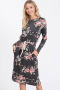 Floral T-shirt dress with long sleeves, drawstring waist, side pockets, and knee-length design in shades of pink and gray.