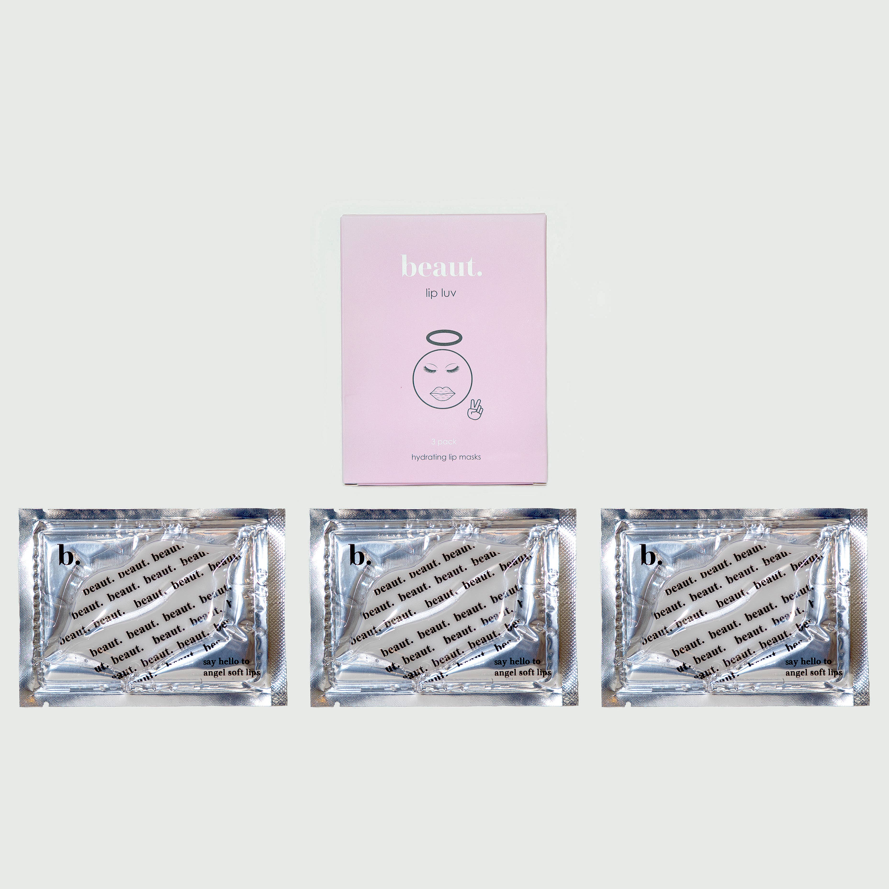 A pink box labeled Lip Luv with a graphic of a face, featuring three individual lip mask packets with a beaut. pattern.