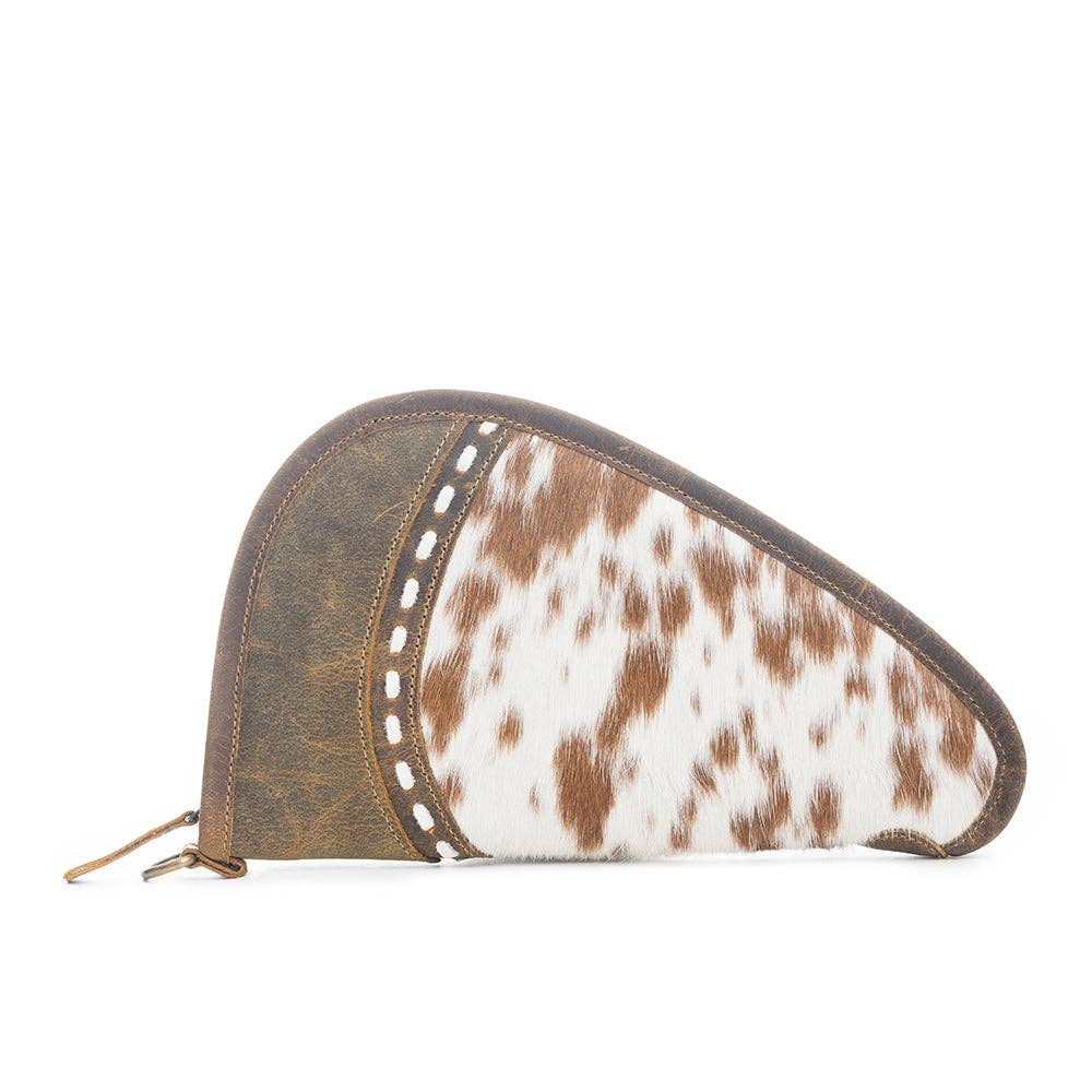 Distinctive gun case in hairon and antiqued leather with chocolate brown trim and wrap-around zipper, perfect for handguns.