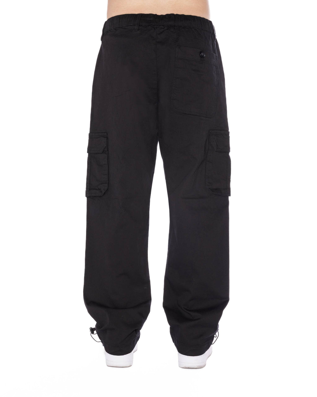 Relaxed-fit black cargo pants featuring side pockets and an elastic waistband with a drawstring for comfort.