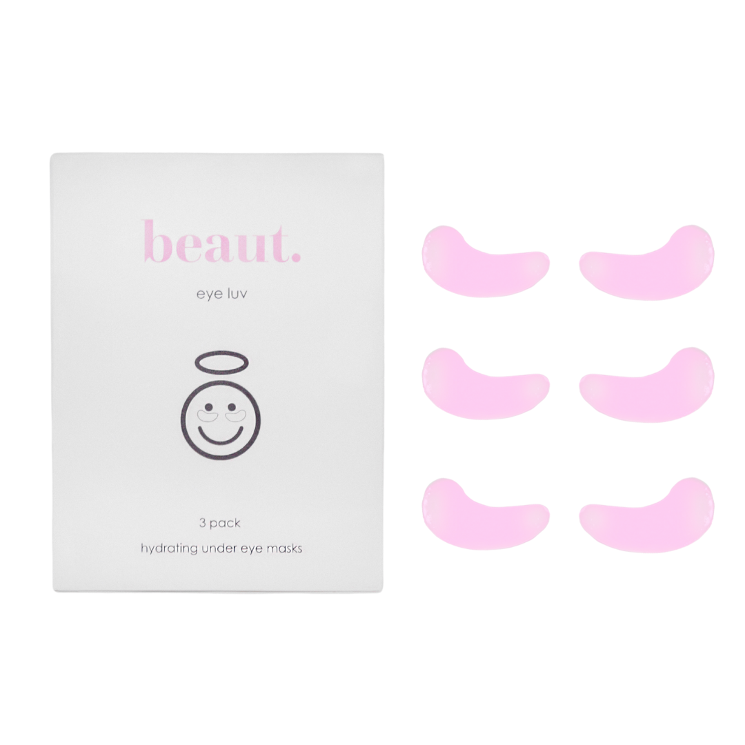 Three pairs of pink under-eye masks in a box labeled 'eye luv' with a smiling face graphic, designed for hydration and brightening.