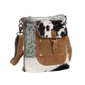 Stylish Eau De Nil Shoulder Bag featuring a mix of textures in green, brown, and black with a front pocket and shoulder strap.