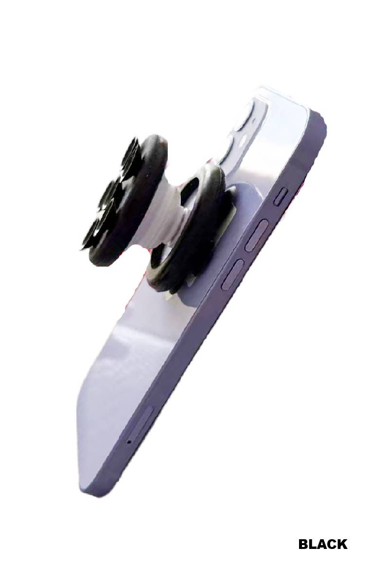 Suction cup phone grip in black and white design, showcasing its placement on a smartphone.