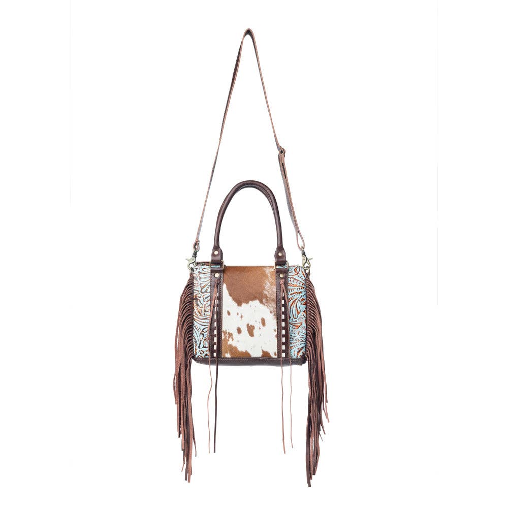 Fringe leather concealed carry bag with a broad handle and spacious design, perfect for everyday use.