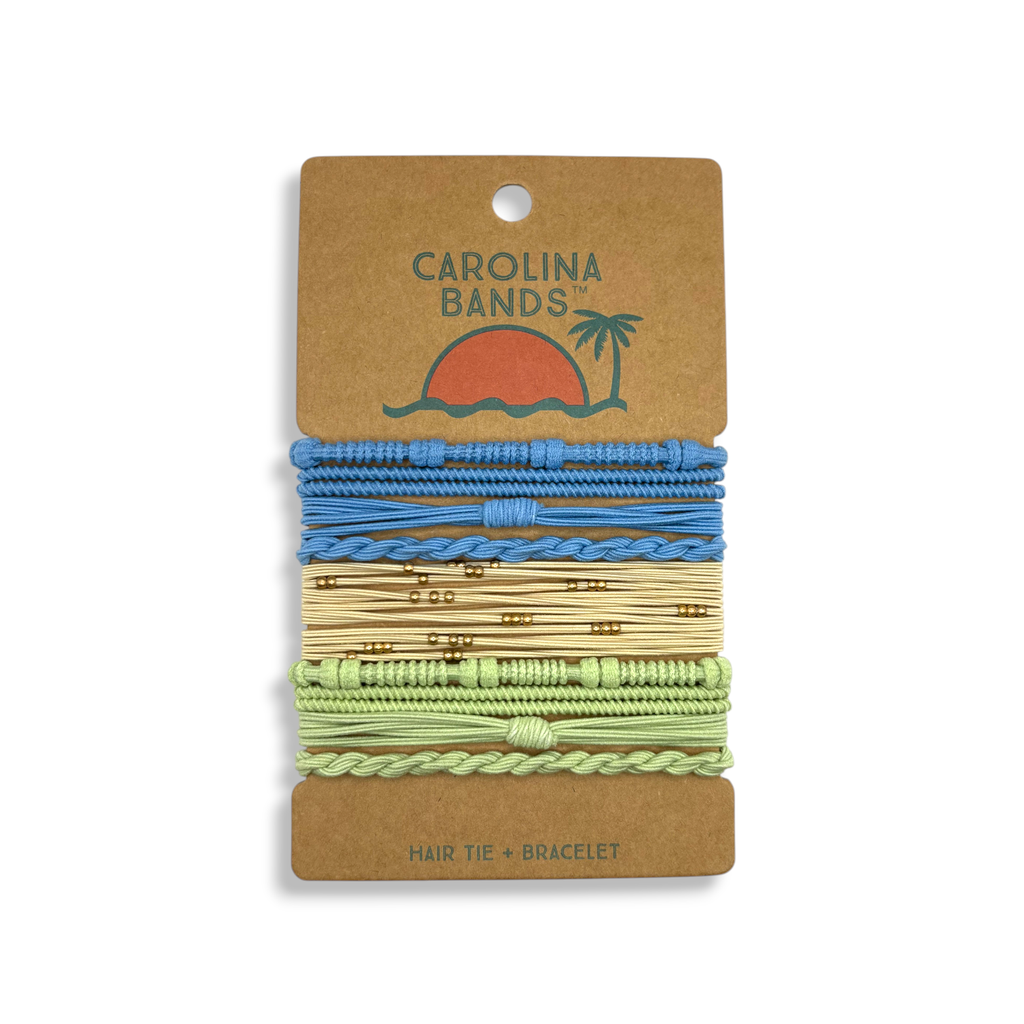 A set of Carolina Bands hair tie bracelets in blue, yellow, and green with various textures and patterns. Perfect for everyday wear.